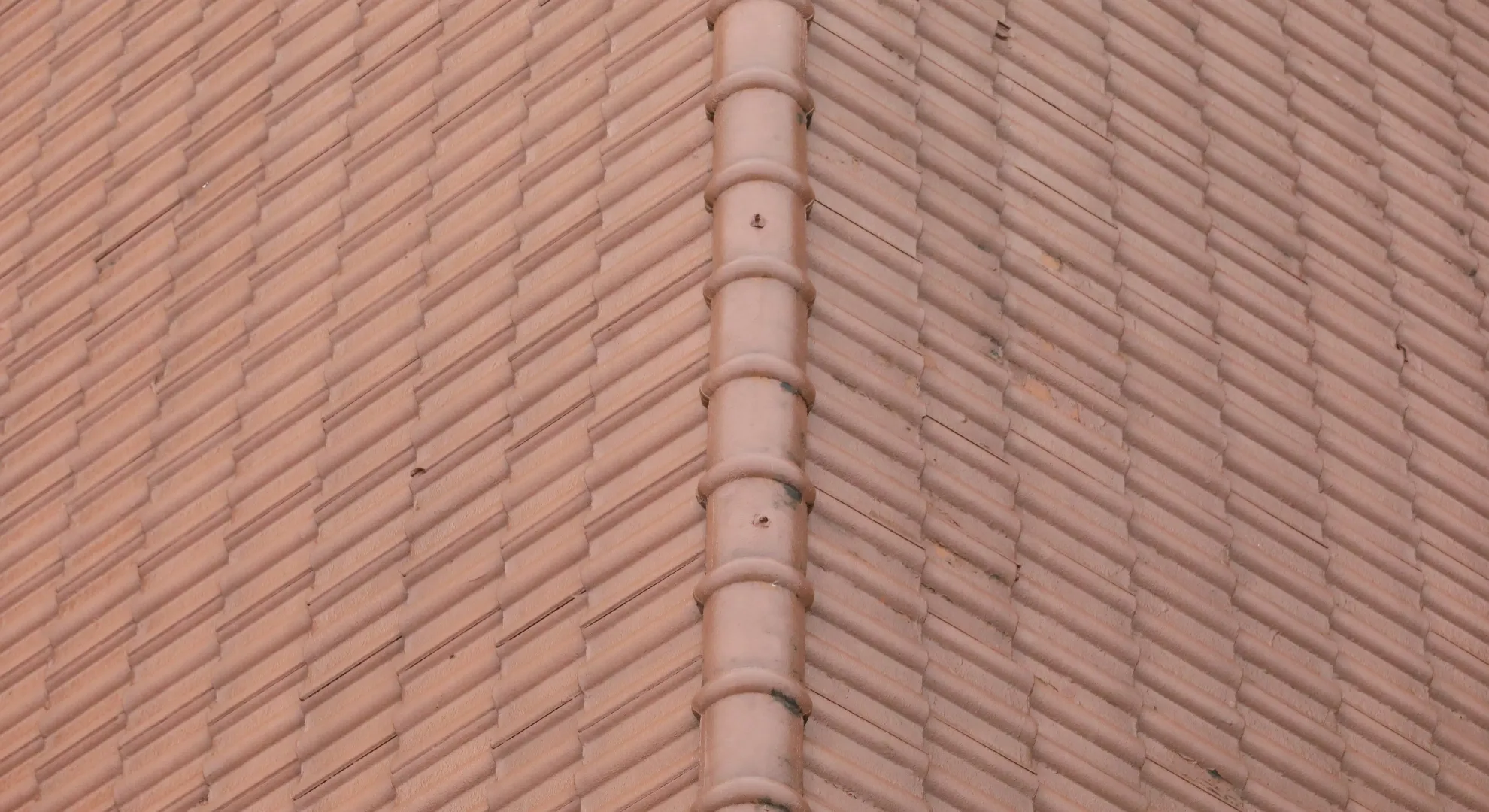 Storm-damaged residential roof requiring emergency repair and assessment